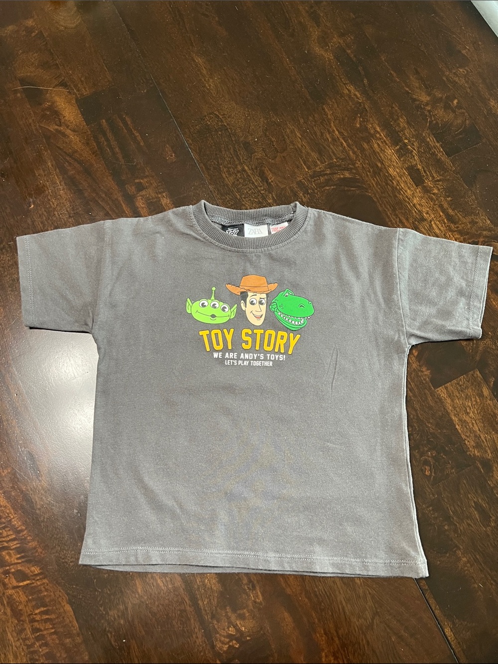Disney Toy Story Gray T‑Shirt with Green Characters and Yellow Logo